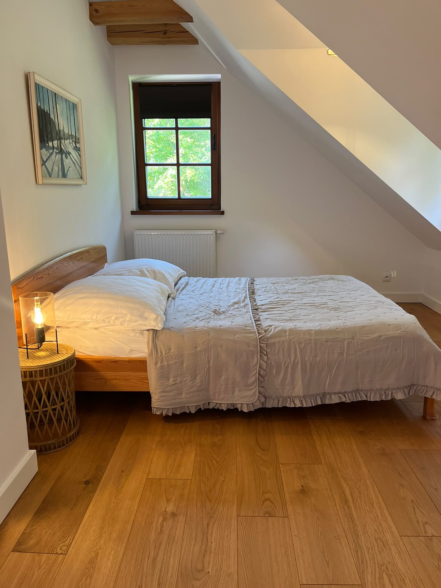 Bedroom with a low forest window