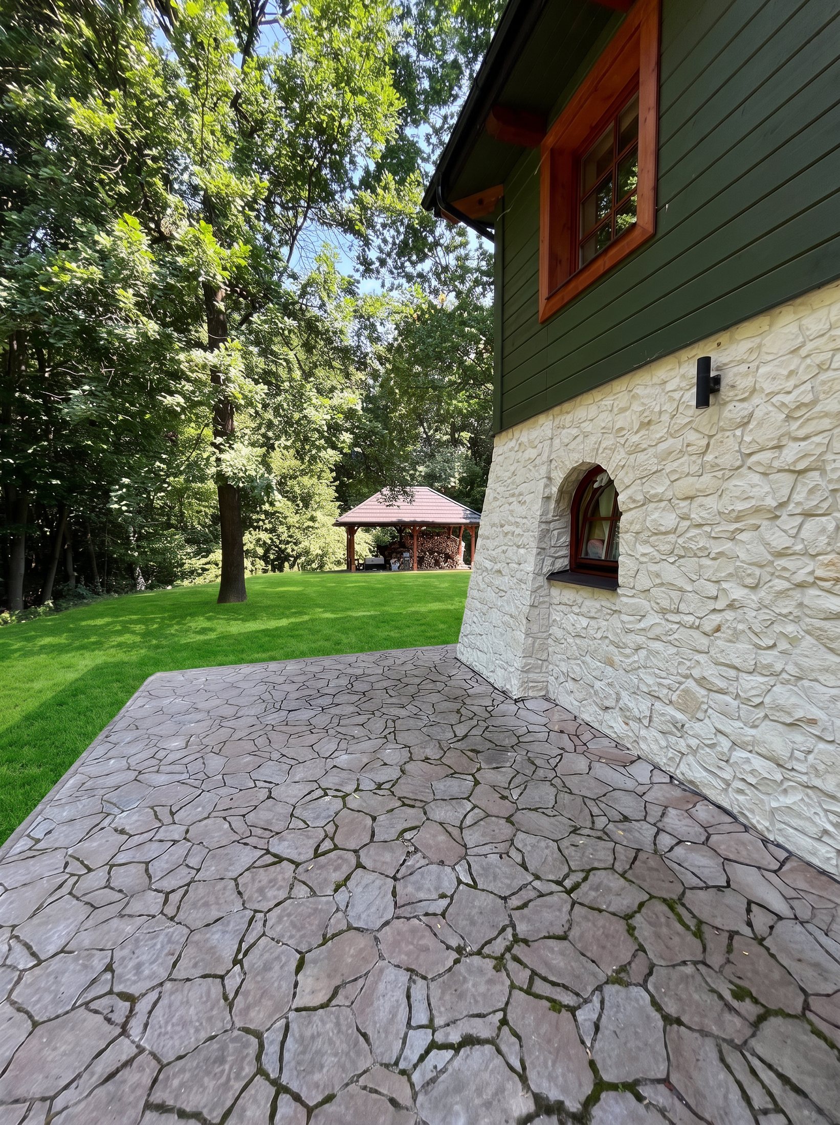 Stone path leading around the house
